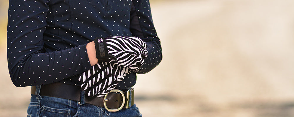 Lifestyle photo of 8600 All Weather Gloves in Zebra Print on young woman